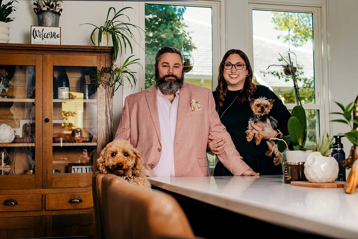 Allen and Lauren Ernst at home with their dogs